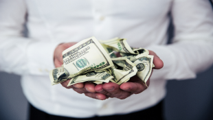 Businessman holding money in hands