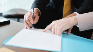 Person signing contract