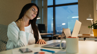 Businesswoman sick at computer