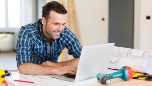 Construction worker at laptop