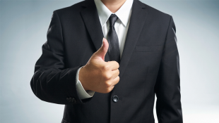 Businessman with thumbs up