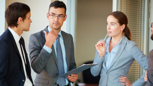 Three businessmembers discussing something