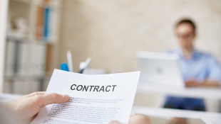 Businessman holding contract