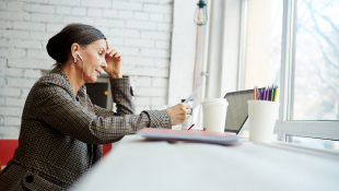 Woman looking worried while reading contract