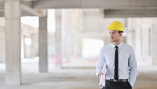 Construction worker walking through site