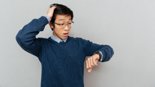 Businessman looking at watch